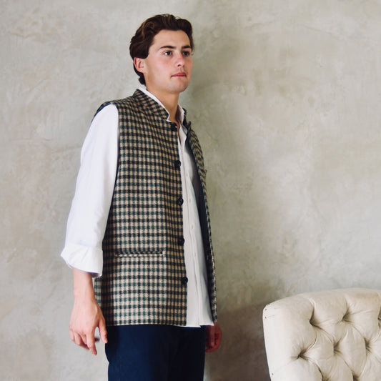 A magnificent and truly luxurious Nehru-Style Gilet in Fox Brothers Green GunClub Check Flannel. Woven in Somerset and Handmade in London, this is the ultimate statement gilet and the top notch in British-made luxury. Bespoke Options Available.