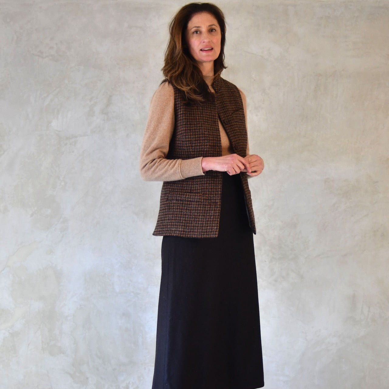 Close up view of Ladies Nehru Style Gilet in dark check tweed. This Lovat Tweed waistcoat is the prefect alternative to a jumper or jacket in winter. Handmade in London.
