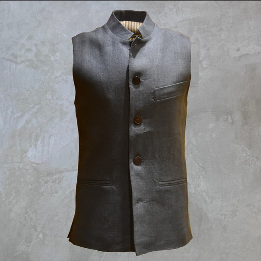 Loose cut Nehru Style Gilet in Deep Navy Linen. This handmade gilet is made from a relaxed mid weight Irish linen. With e Nehru collar detail, three external pockets and a five-buttoned front it is smart enough for work - and yet perfect for the weekend. Front Shot.
