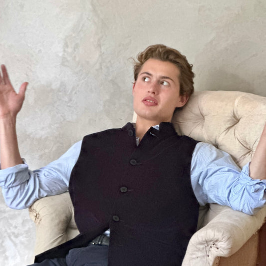 Slim Cut Nehru Style Gilet in Navy Velvet. This pure cotton velvet waistcoat is lined in pure cotton striped ticking. Handmade in London the gilet has three outer and two inner pockets. a Nehru collar and Blue Corozo Buttons. Perfect for a swell night out.