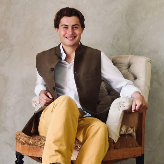 Slim Cut Nehru Style Gilet in Khaki Moleskin. This pure cotton gilet is lined in striped cotton Ticking. With a Nehru collar and five pockets it will take you everywhere and keep you warm on cooler days. Made by Hand in London. SeatedView.