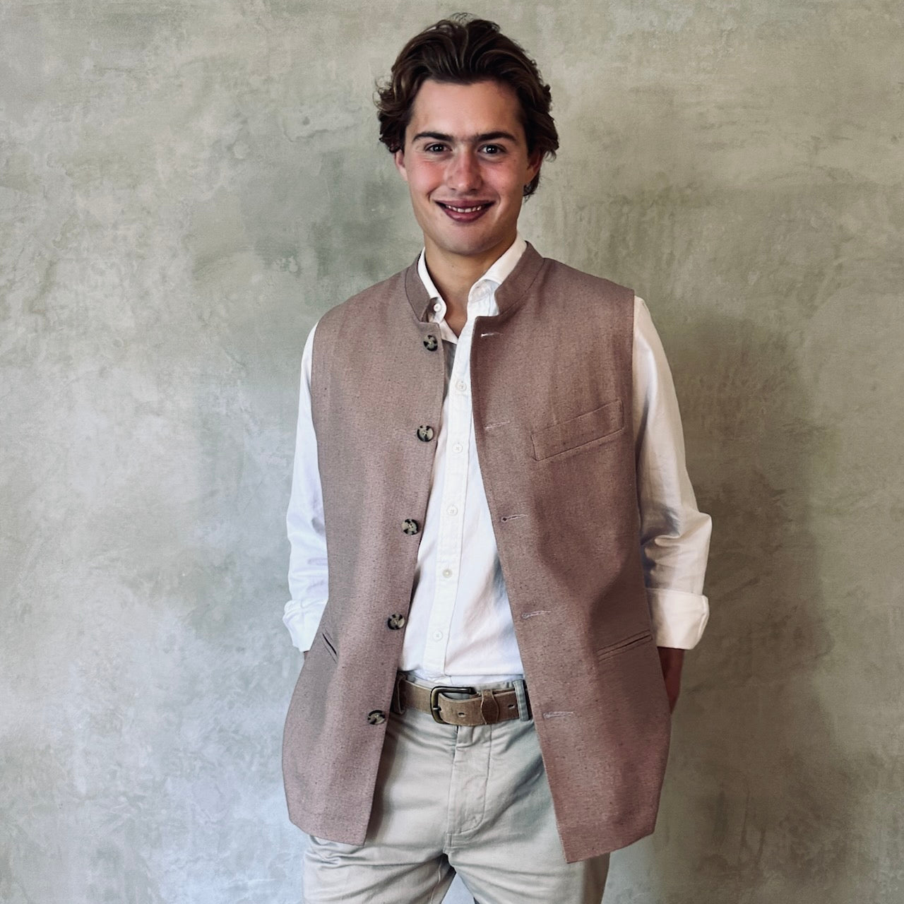 Slim fit Nehru style gilet for spring summer wear. Handmade in London this purse silk waistcoat is fully lined, has a Nehru collar and five corozo buttons to the front. With three outside and two inside pockets it is a perfect alternative to a jacket in summer. 