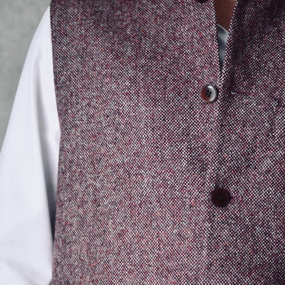 Fabric Close up of a superb and wonderfully warm alternative to a jacket for autumn winter with a neat cut and ample pocket space. Sophisticated enough for Town, Warm enough for the Country.

This fitted cut waistcoat has five button-fronts and side vents for ease when moving and sitting. Fully lined, it has generous inside facings to avoid unsightly lining slippage.

Handmade in London.