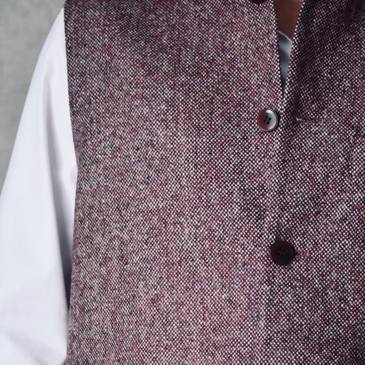Fabric Close up of a superb and wonderfully warm alternative to a jacket for autumn winter with a neat cut and ample pocket space. Sophisticated enough for Town, Warm enough for the Country.

This fitted cut waistcoat has five button-fronts and side vents for ease when moving and sitting. Fully lined, it has generous inside facings to avoid unsightly lining slippage.

Handmade in London.