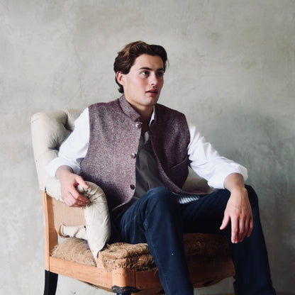A superb and wonderfully warm alternative to a jacket for autumn winter with a neat cut and ample pocket space. Sophisticated enough for Town, Warm enough for the Country.

This fitted cut waistcoat has five button-fronts and side vents for ease when moving and sitting. Fully lined, it has generous inside facings to avoid unsightly lining slippage.

Made in Great Britain.