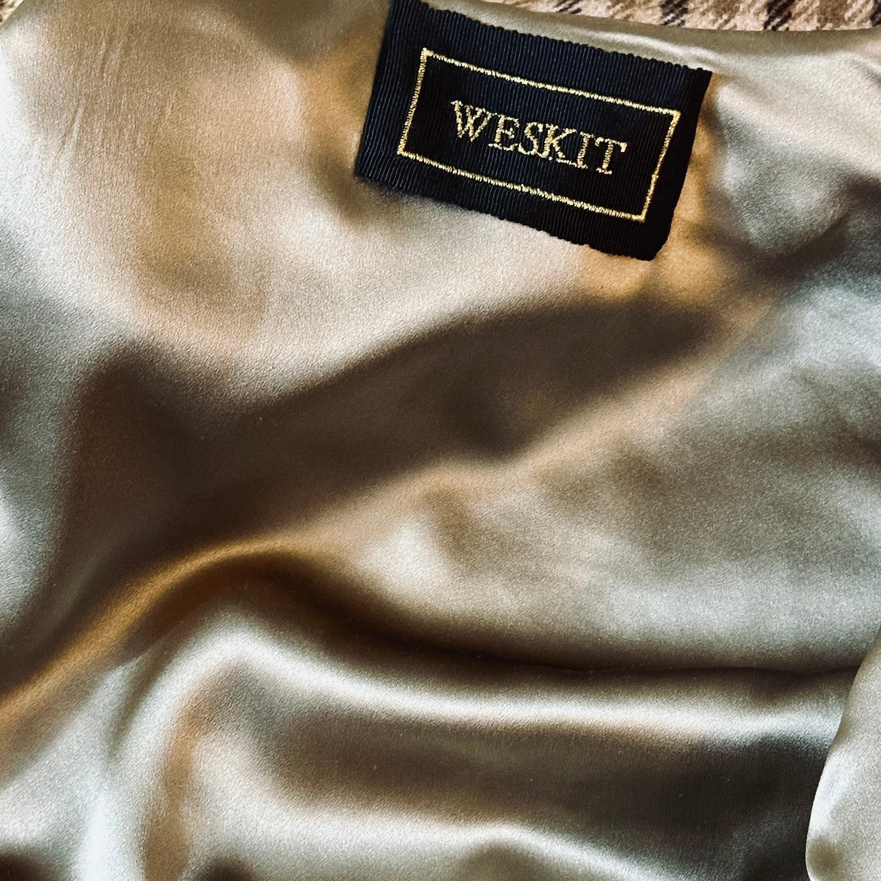 Silk Lining and embroidered label shown on a Bespoke Silk Lined Weskit Gilet in Fox Flannel gunclub in Brown.