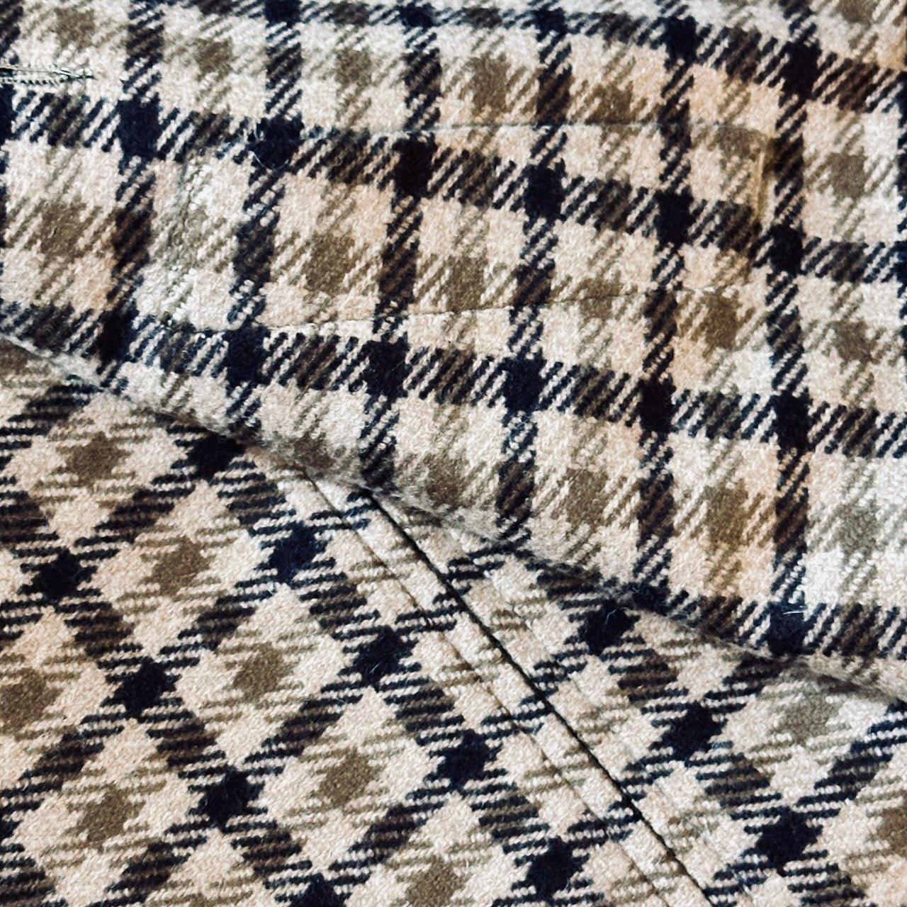 Fabric Close up showing Silk Lined Weskit Gilet in Fox Flannel gunclub in Brown. Handmade in London.
