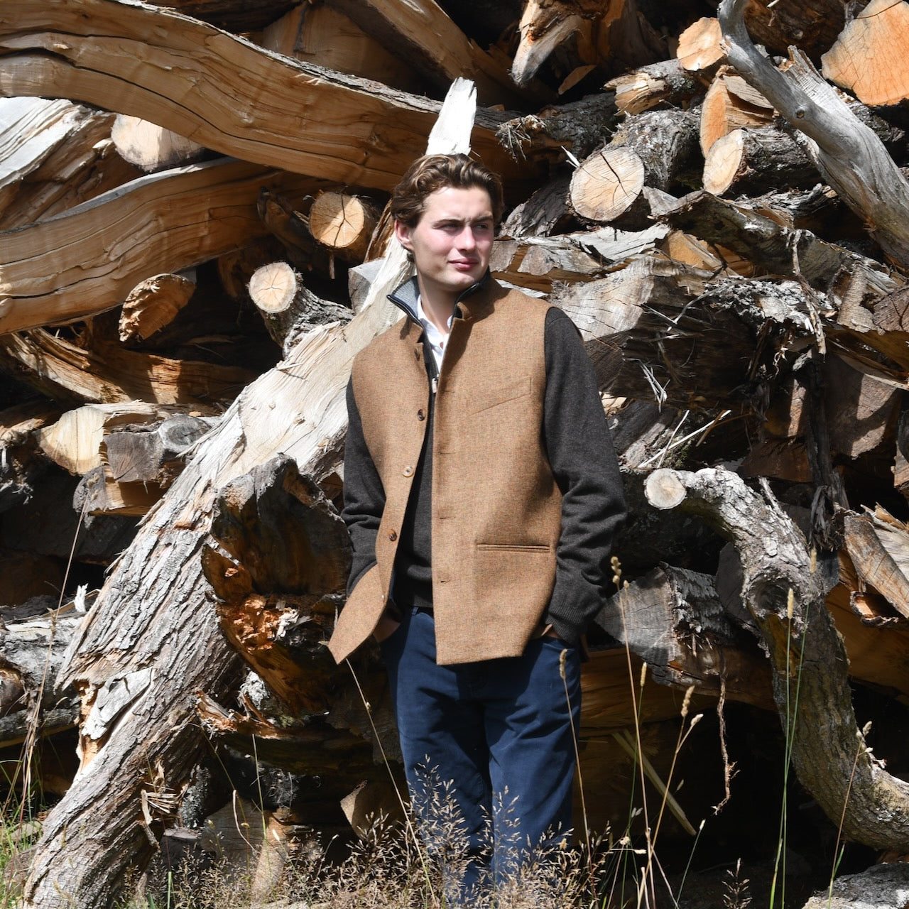 Warm and snug gilet. Fitted Nehru style gilet in a lovely orange brown Yorkshire tweed. Three outside and two inside pockets make this a splendid alternative to a jacket. It can be dressed up or down and the finely woven tweed will work as well in the city as in the country. Handmade in London.