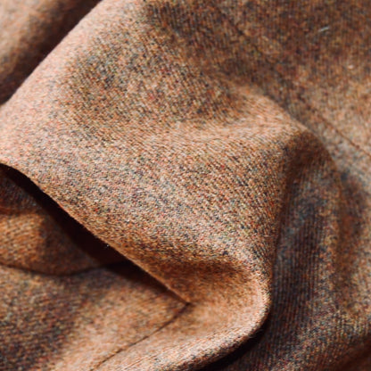 Fabric Close up on Fitted Cut Nehru Style Gilet in Brown finely woven Yorkshire tweed. Handmade in London, this gilet has five buttons to the front, a Nehru collar. three outside and two inside pockets. Smart and wearable in both Town and Country.