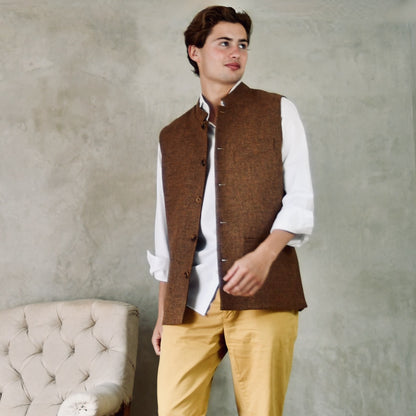 Fitted Cut Nehru Style Gilet in Brown finely woven Yorkshire tweed. Handmade in London, this gilet has five buttons to the front, a Nehru collar. three outside and two inside pockets. Smart and wearable in both Town and Country. Motion View.