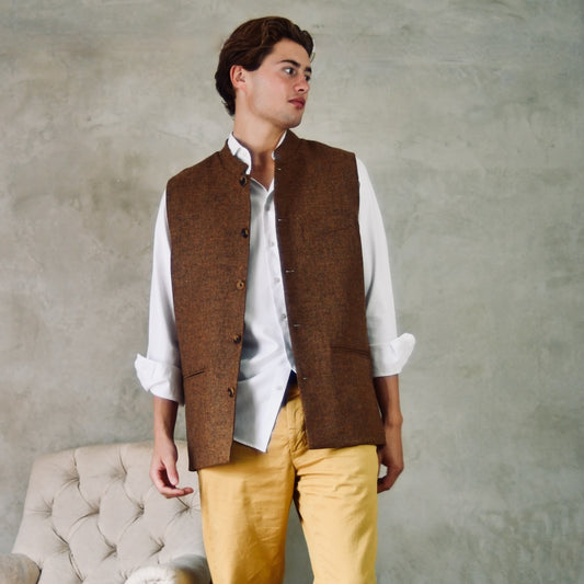 Fitted Cut Nehru Style Gilet in Brown finely woven Yorkshire tweed. Handmade in London, this gilet has five buttons to the front, a Nehru collar. three outside and two inside pockets. Smart and wearable in both Town and Country.
