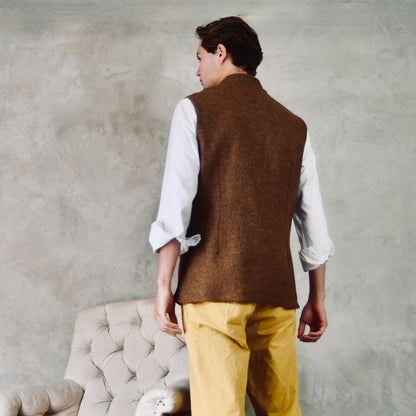 Rear View of Fitted Cut Nehru Style Gilet in Brown finely woven Yorkshire tweed. Handmade in London, this gilet has five buttons to the front, a Nehru collar. three outside and two inside pockets. Smart and wearable in both Town and Country.