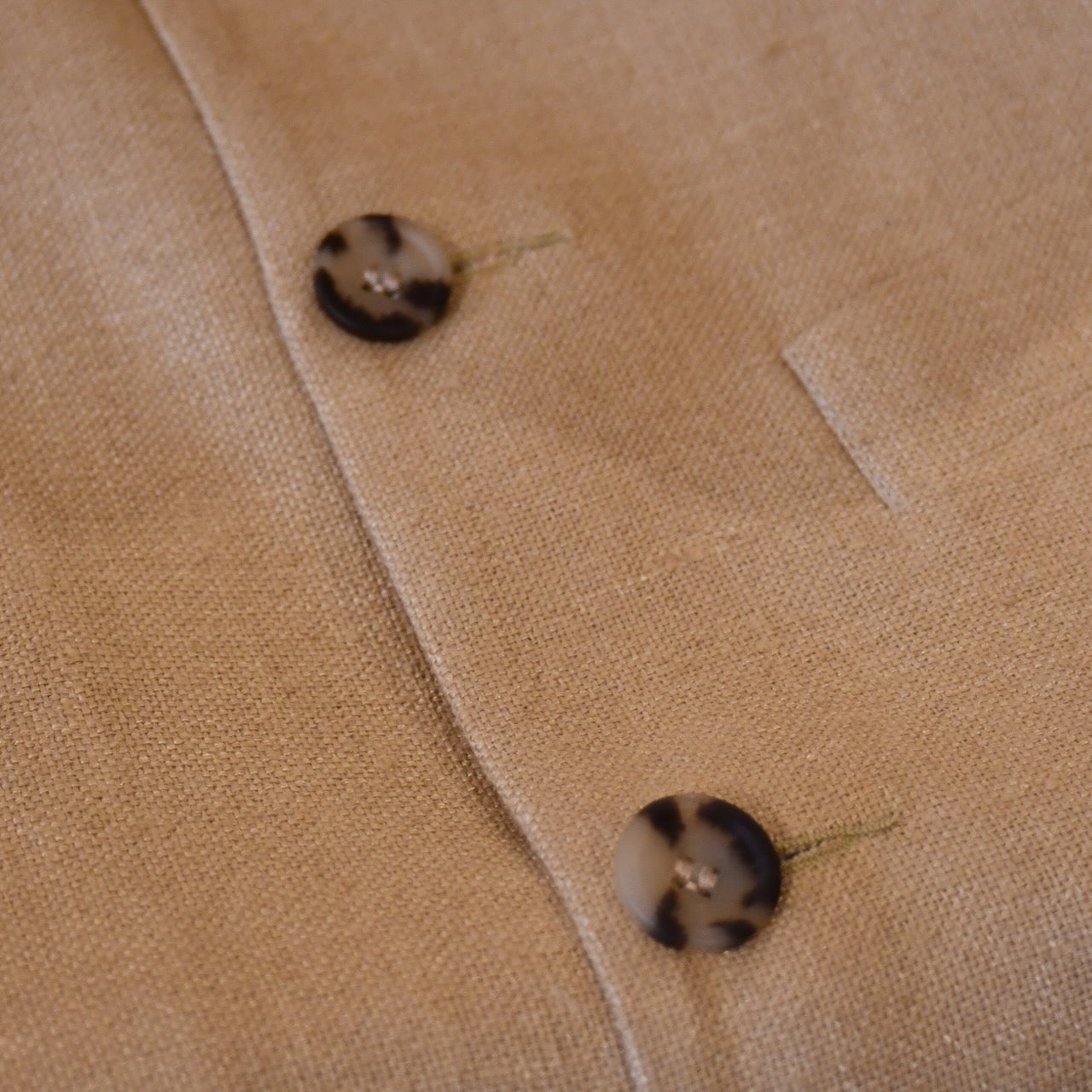 Courtney & Co  Light Cornu buttons made in Gloucestershire for Bespoke Weskit Gilets. Handmade in London. Shown on Bespoke Raffia Silk Matka Waistcoat.