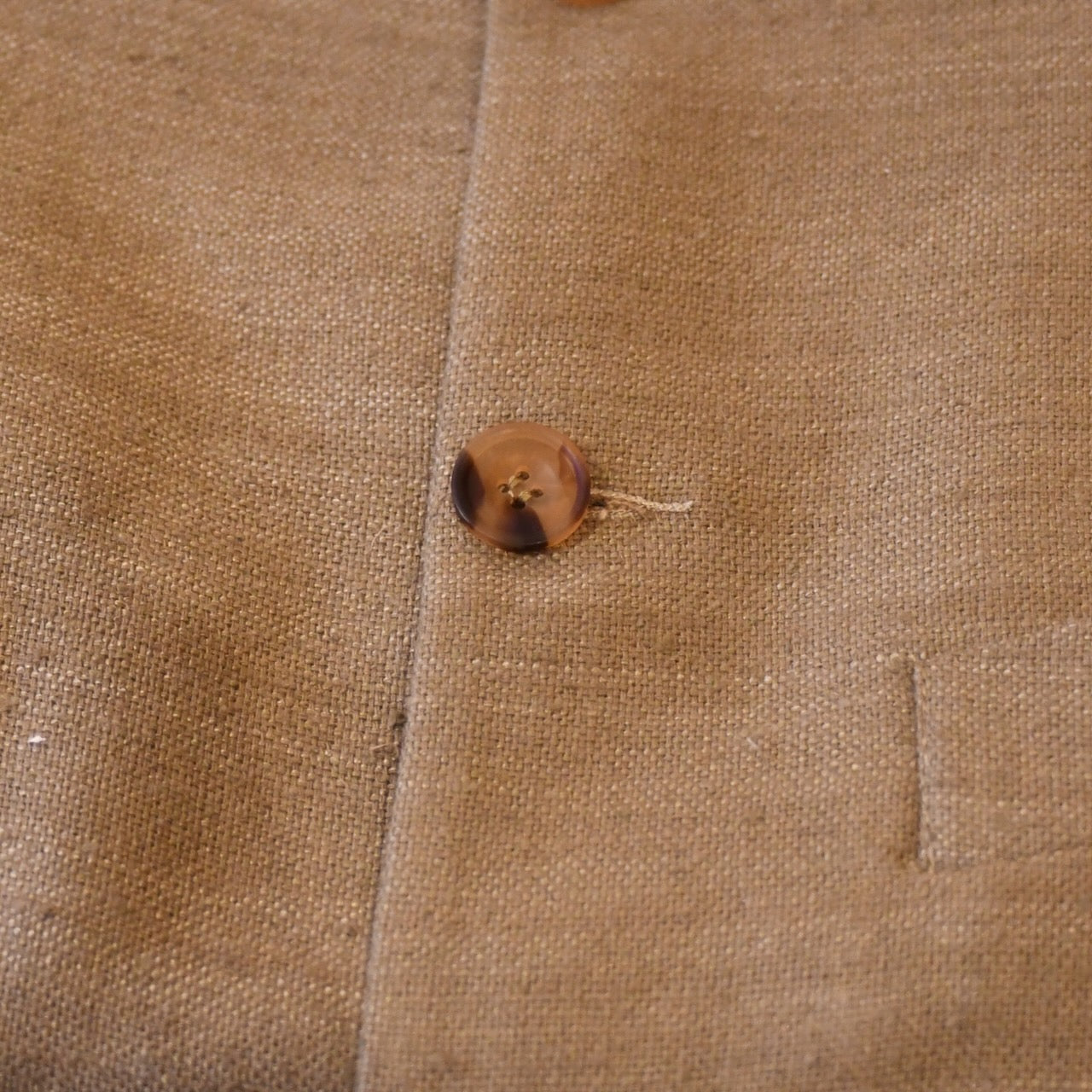 Courtney & Co  Dark Cornu buttons made in Gloucestershire for Bespoke Weskit Gilets. Handmade in London. Shown on Bespoke Khaki Silk Matka Waistcoat.