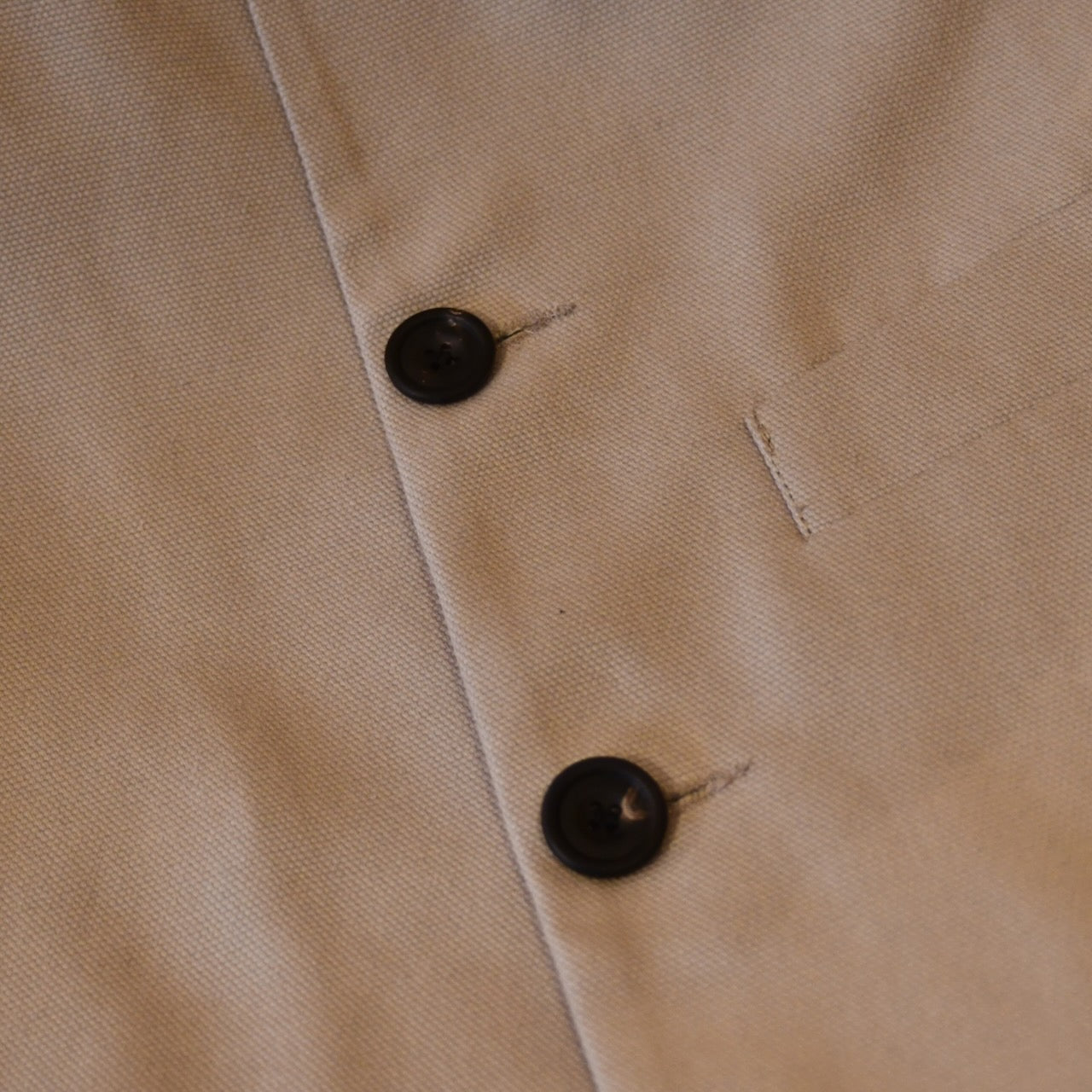 Courtney & Co  Flat Horn buttons made in Gloucestershire for Bespoke Weskit Gilets. Handmade in London. Shown on Bespoke Cotton Canvas Waistcoat.