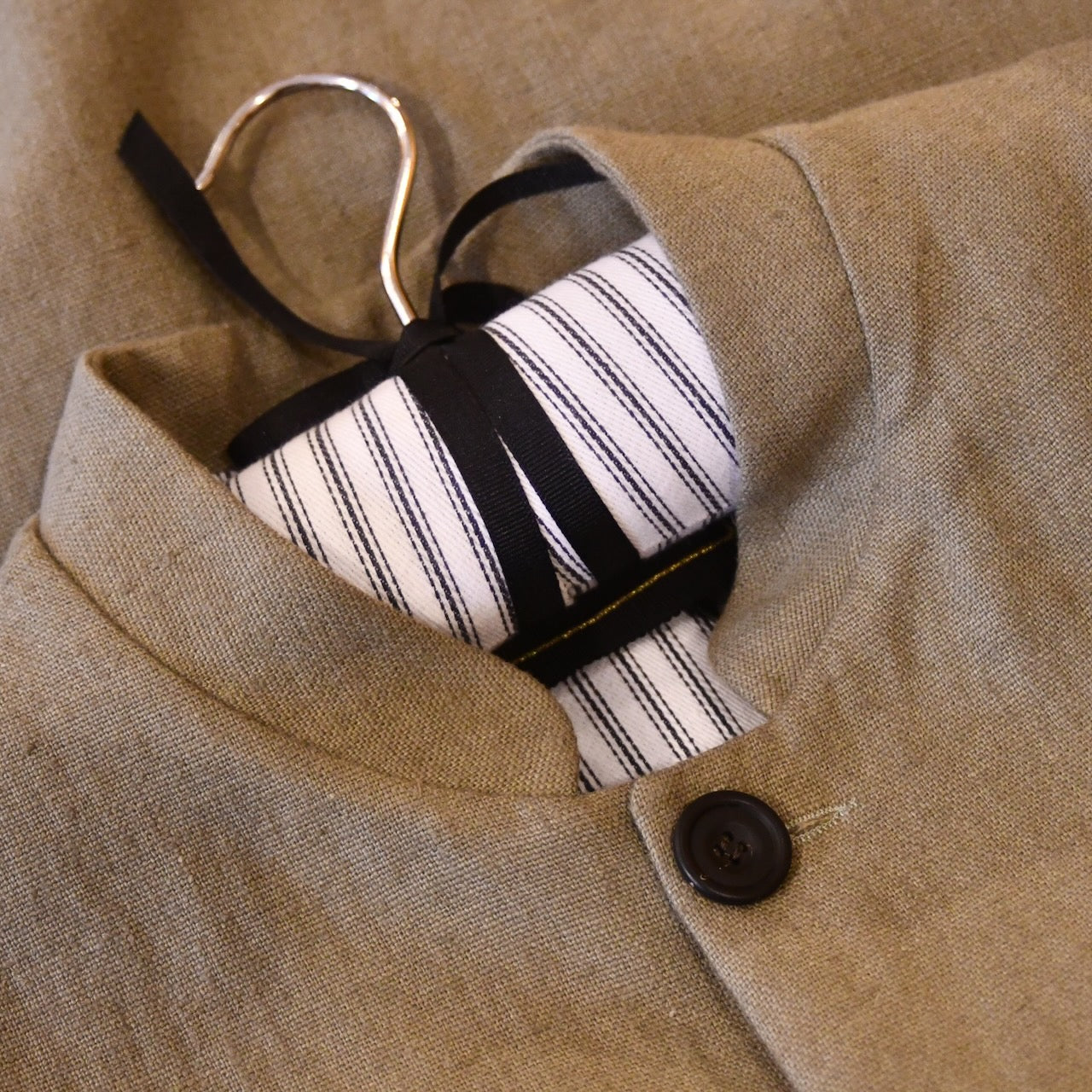 Courtney & Co  Ridged Horn buttons made in Gloucestershire for Bespoke Weskit Gilets. Handmade in London. Shown on Bespoke Irish Linen Waistcoat.