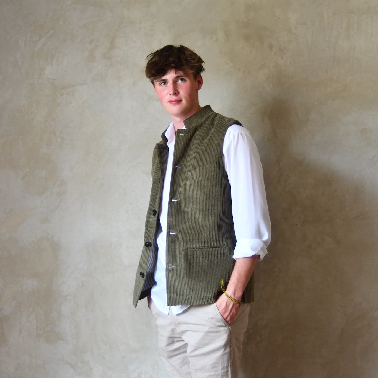 Bespoke Loose Cut Nehru Style Gilet in Khaki Cotton Corduroy. Handmade in London. Shown Over White Shirt, Unbuttoned.