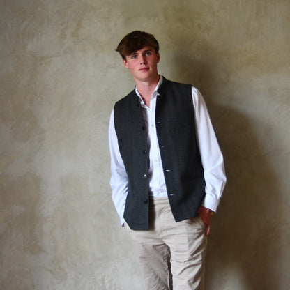 Cashmere-Lambswool Mix gilet in Dark Grey Herringbone Flannel. Woven in Yorkshire and Made by Hand in London.
This Bespoke Waistcoat is entirely made by hand within the British Isles.