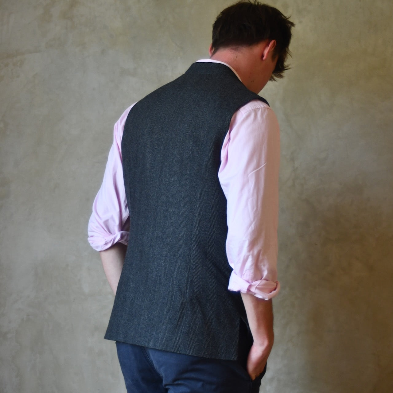 Cashmere-Lambswool Mix gilet in Dark Grey Herringbone Flannel. Woven in Yorkshire and Made by Hand in London.
This Bespoke Waistcoat is entirely made by hand within the British Isles.