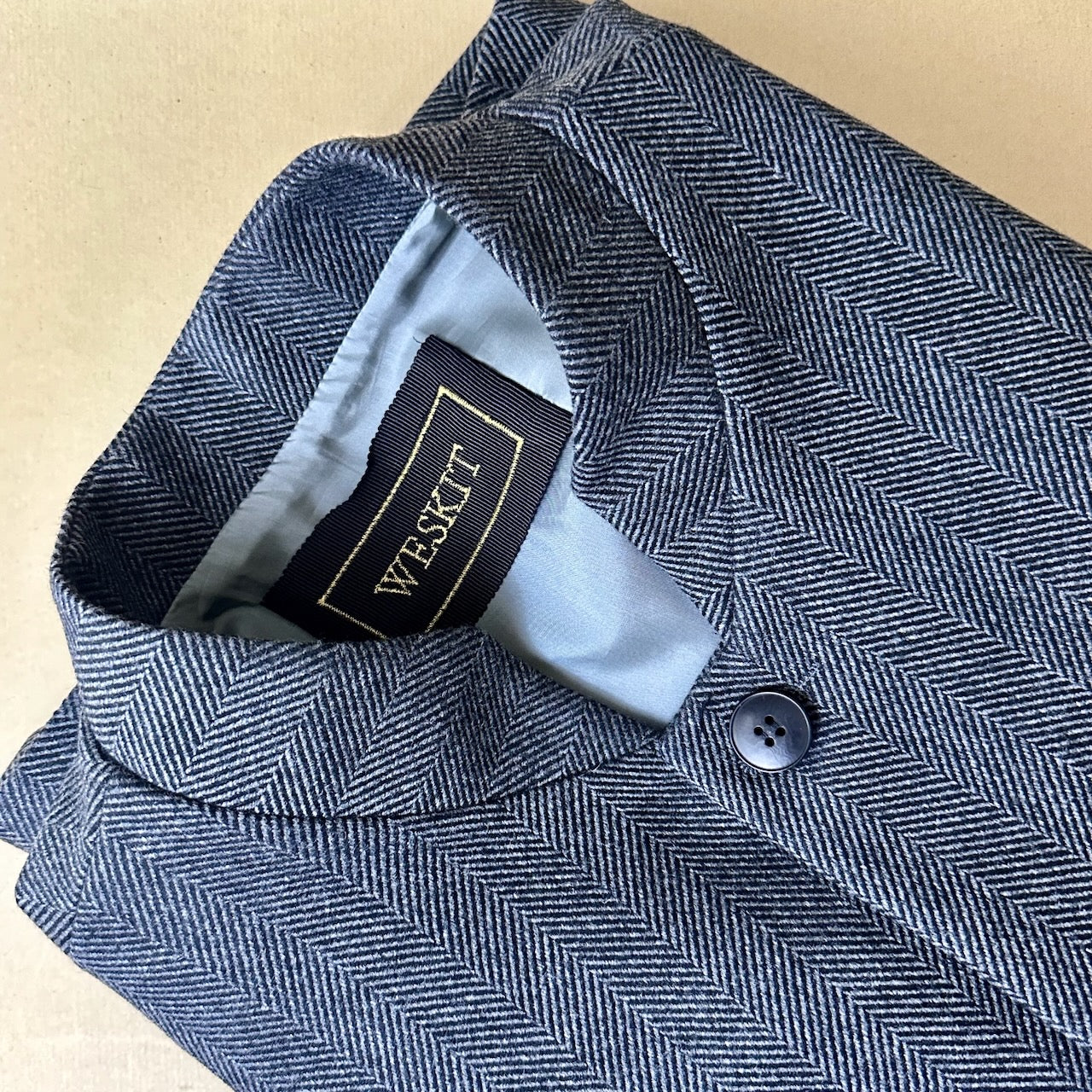 Detail  Shot. A wonderfully smart alternative to a jacket or jumper, this Nehru-style gilet has a comfortable cut and ample pocket space. Warm and easy to wear, it will work from office to dinner and back again.
Fve button-front and side vents for ease when moving and sitting. Fully lined. Handmade in Britain.