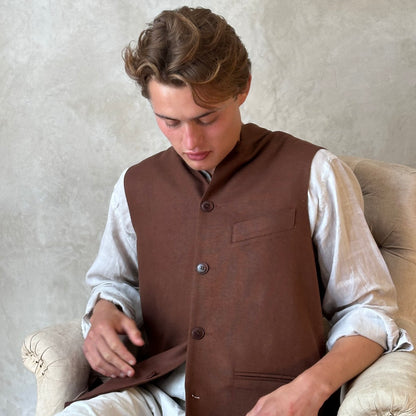 Loose fitting summer weight Nehru Style gilet in brown silk matka. Handmade in London. Seated Close Up.