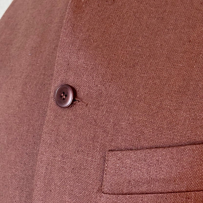 Close up shot showing fabric detail of loose fitting summer weight Nehru Style gilet in brown silk matka. Handmade in London. Lined in Cotton Ticking.