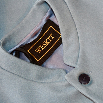 Collar Detail on Pocket Detail on blue doeskin Nehru Style Gilet. A superb alternative to a jacket or jumper in winter with a comfortable cut and ample pocket space. Warm, elegant and easy to wear, it will smarten you up a treat.
This relaxed cut has a five button-front and side vents for ease when moving and sitting. Fully lined, it has generous inside facings to avoid unsightly lining slippage.
Handmade in London.