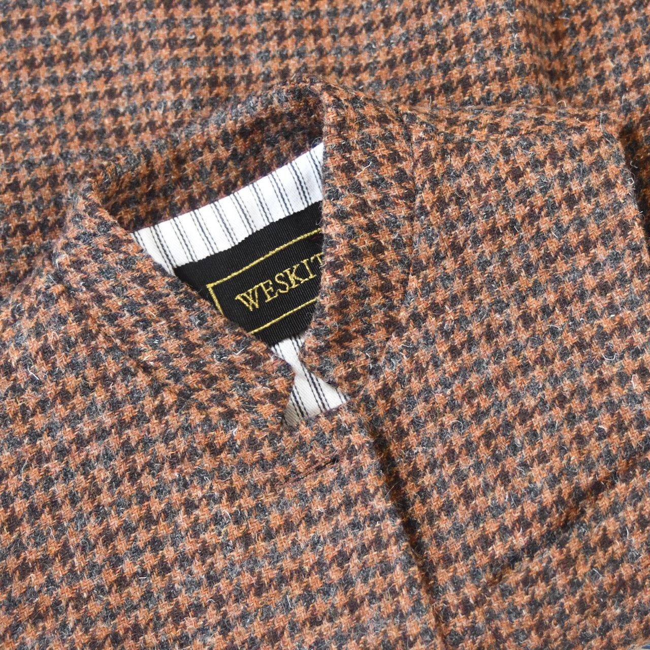 Collar Detail on a Bespoke NehruStyle Gilet from Weskit in Dep Copper Check Tweed from Lovat Mill. Handmade in London.