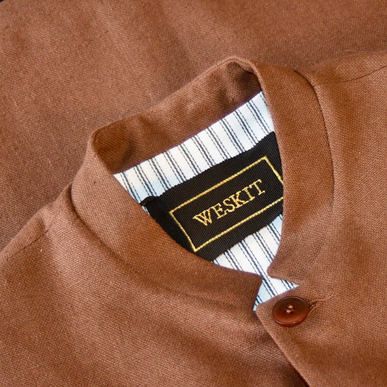 Close up on collar of Loose fitting summer weight Nehru Style gilet in brown silk matka. Handmade in London. Lined in Cotton Ticking.