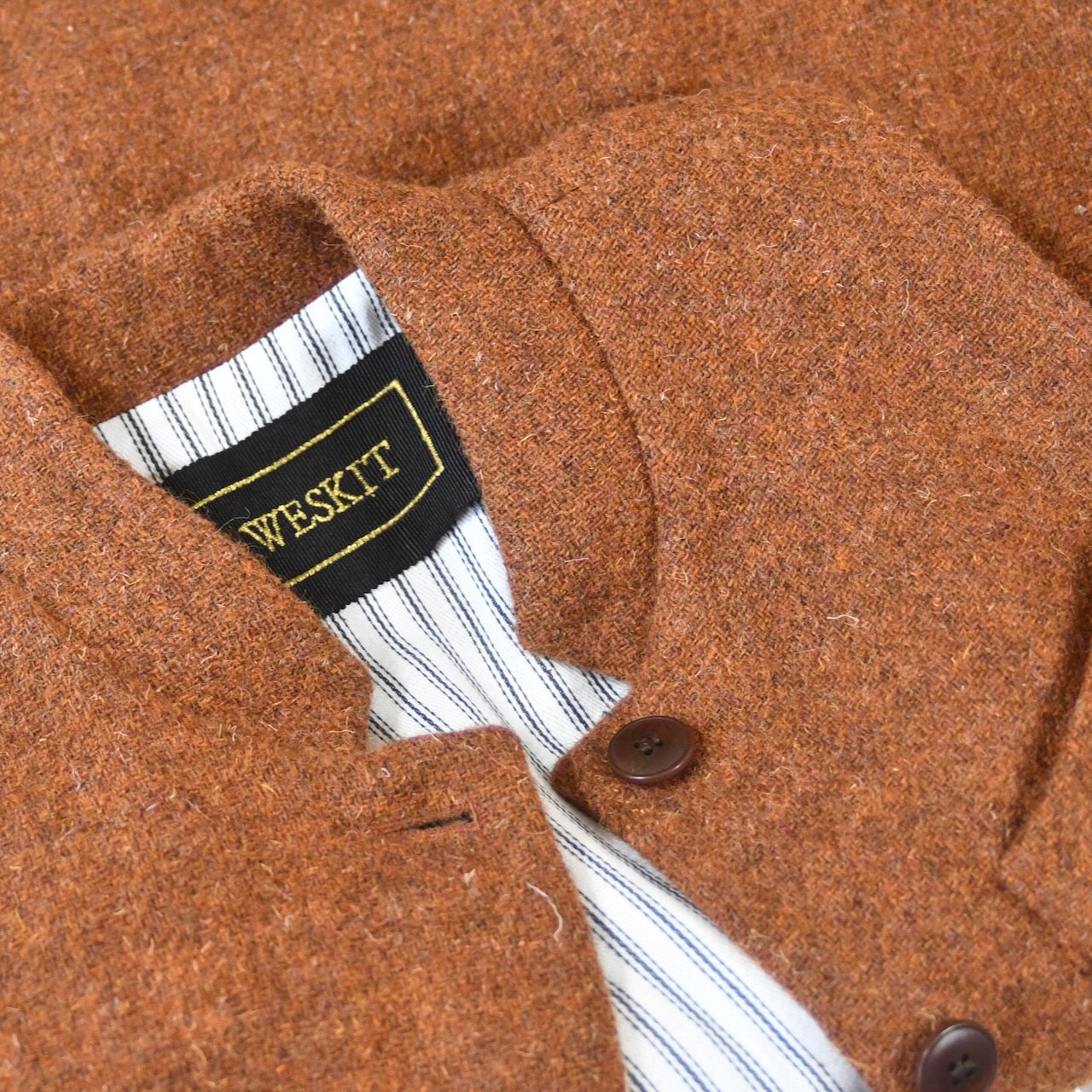 Collar Shot on  A superb alternative to a jacket or jumper in winter – especially on those cooler days. Warm and superbly smart, this thick wool gilet will work as well inside as outside and has ample pocket space.
This fitted cut has a neat five button-front, tapered darts at the rear and side vents for ease when moving and sitting. Fully lined; Handmade in Britain.