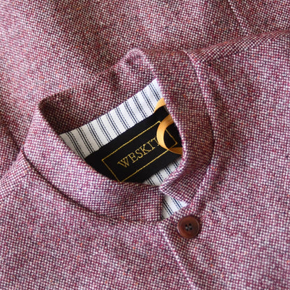 Collar Detail showing Nehru Collar, Striped Ticking lining and Silk Embroidered Label on a superb and wonderfully warm alternative to a jacket for autumn winter with a neat cut and ample pocket space. Sophisticated enough for Town, Warm enough for the Country.

This fitted cut waistcoat has five button-fronts and side vents for ease when moving and sitting. Fully lined, it has generous inside facings to avoid unsightly lining slippage.

Handmade in London.
