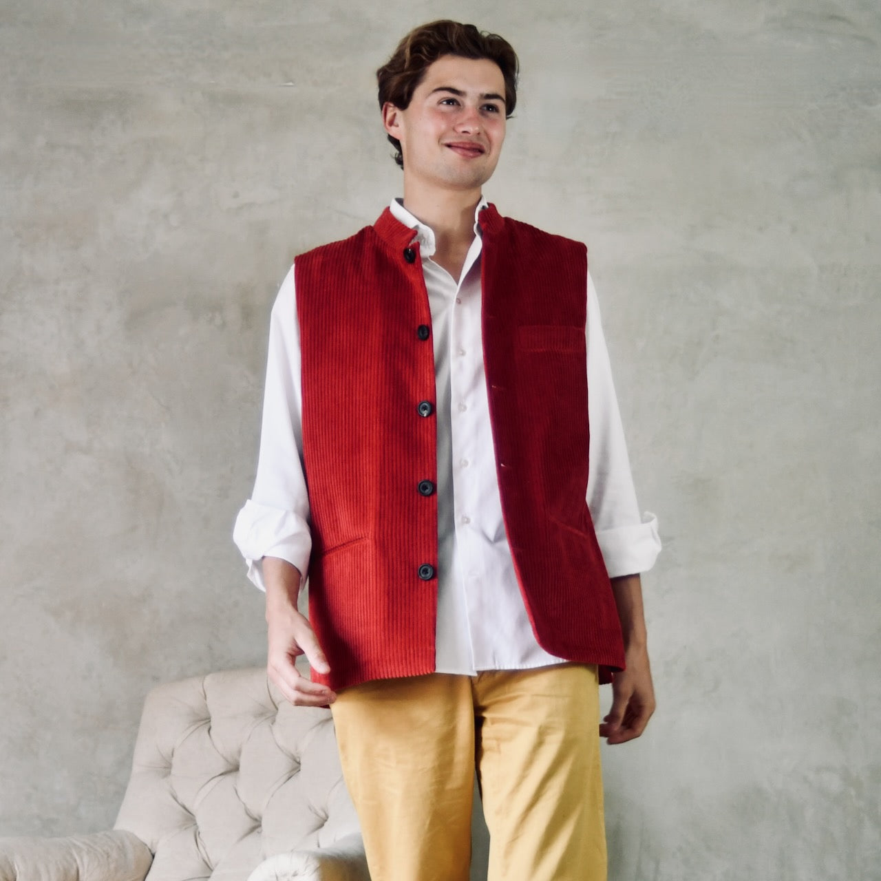 Fitted Nehru-Style Gilet in Claret Corduroy. This pure cotton corduroy gilet has five pockets, neat shaping at the waist to give a nicely fitted, tailored look and a five buttoned front. Handmade in London.