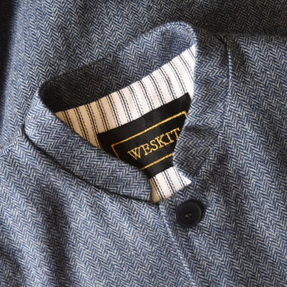 Detail collar shot of Mandarin Collared Tweed Gilet in Blue Herringbone.