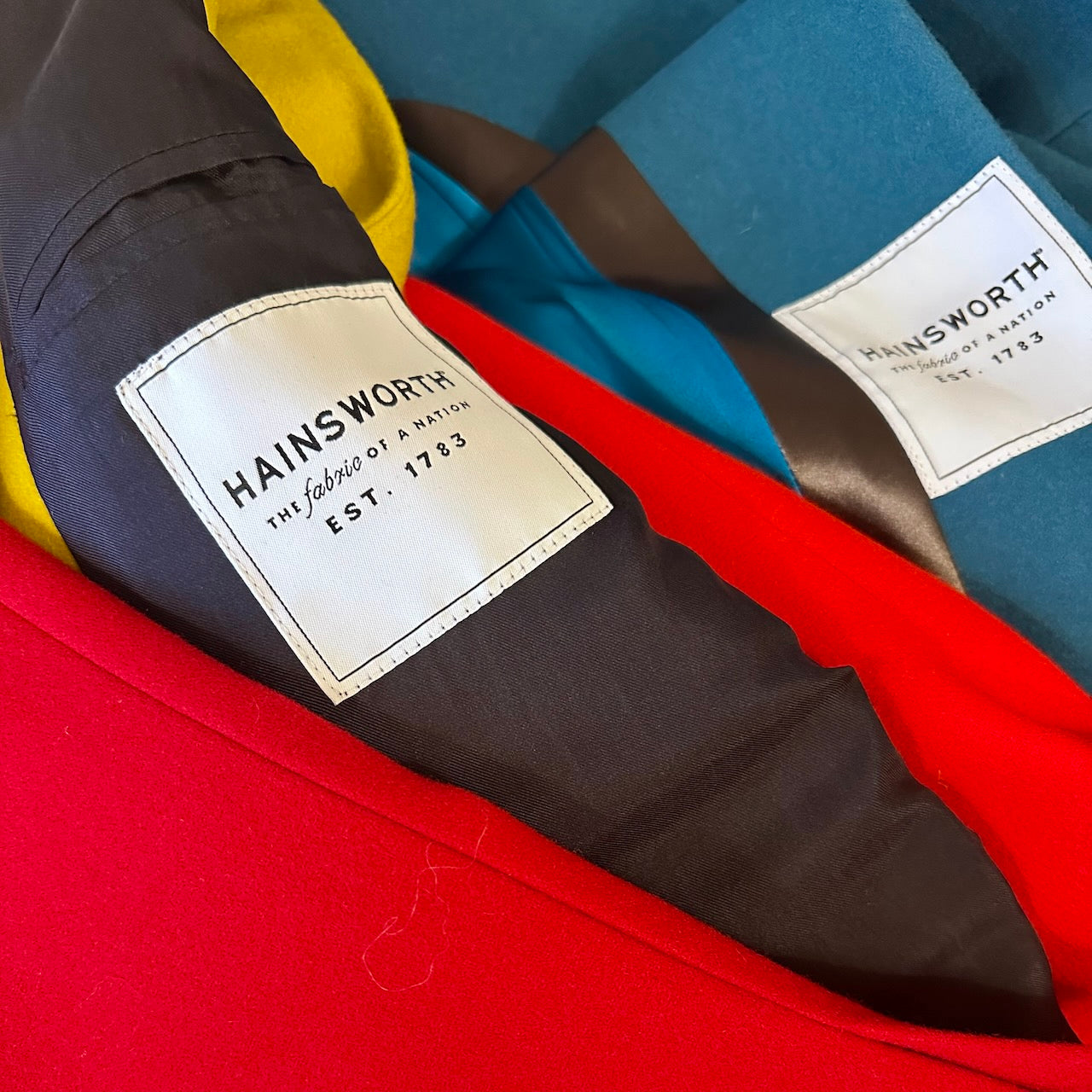 AW Hainsworth Maker Labels on Weskit Gilets. Handmade Gilet. Made in London. Entirely made in Great Britain.