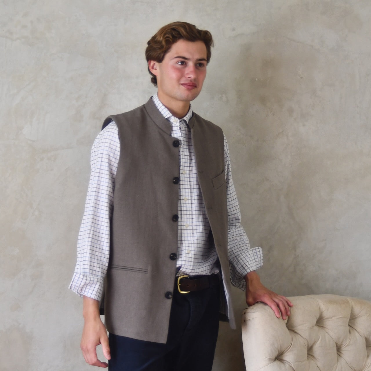Spring summer relaxed fit Nehru style gilet in slubby Irish linen. This browning coloured linen waistcoat is fully lined in pure cotton ticking. With three outside and two inside pockets it is the perfect alternative to a jacket on warmer days. Made by Hand in Britain.