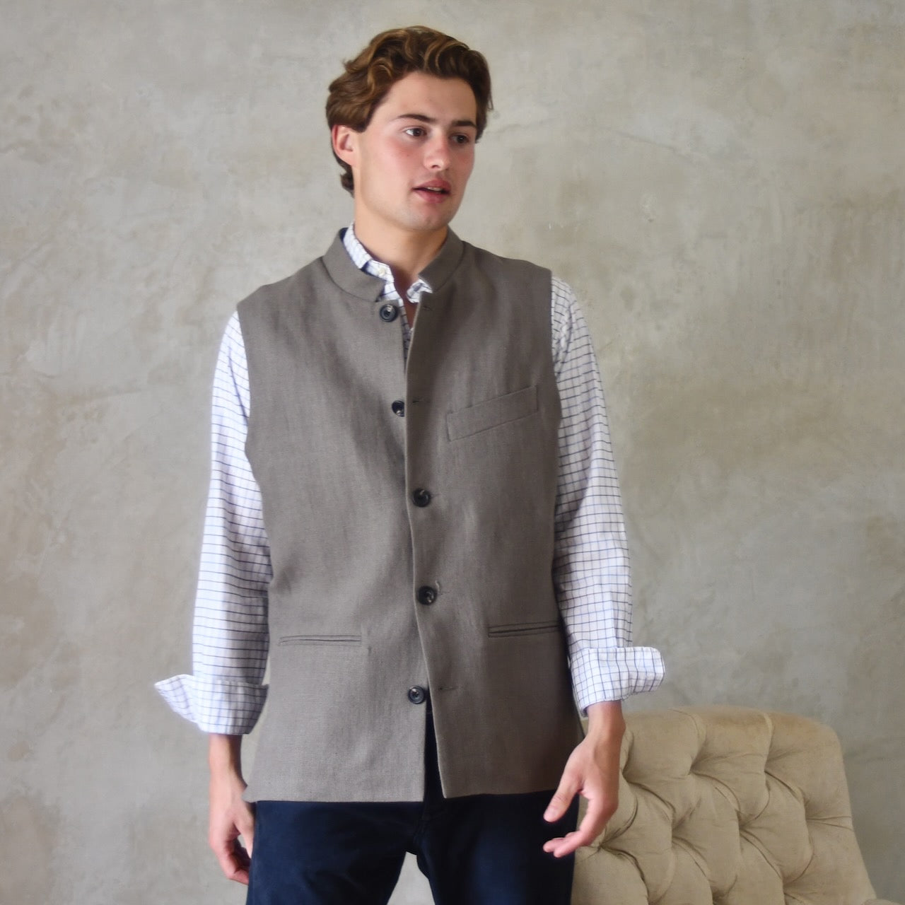 Spring summer relaxed fit Nehru style gilet in slubby Irish linen. This browning coloured linen waistcoat is fully lined in pure cotton ticking. With three outside and two inside pockets it is the perfect alternative to a jacket on warmer days. British-Made.