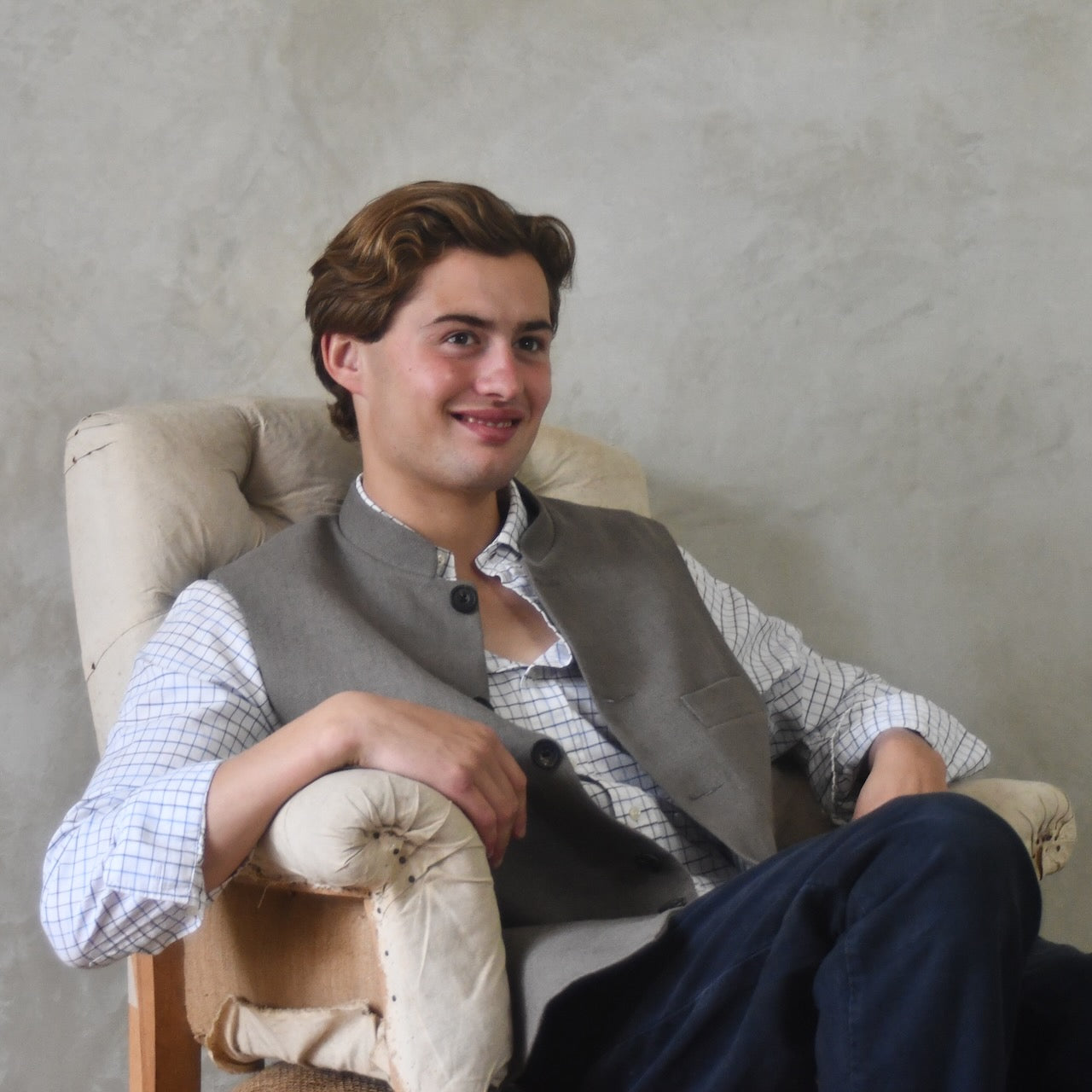 Spring summer relaxed fit Nehru style gilet in slubby Irish linen. This browning coloured linen waistcoat is fully lined in pure cotton ticking. With three outside and two inside pockets it is the perfect alternative to a jacket on warmer days.  Entirely made in Great Britain.