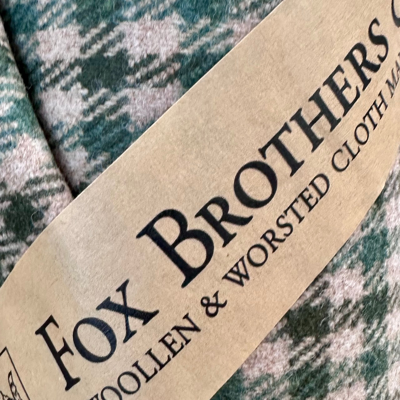 Fabric Close up on a magnificent and truly luxurious Nehru-Style Gilet in Fox Brothers Green GunClub Check Flannel. Woven in Somerset and Handmade in London, this is the ultimate statement gilet and the top notch in British-made luxury.