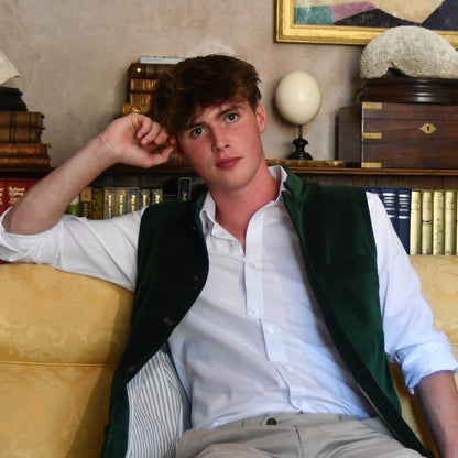 Seated Open unbuttoned model shot of Bottle Green Velvet Nehru-Style Gilet.
Handmade in London.
Entirely made in Great Britain.