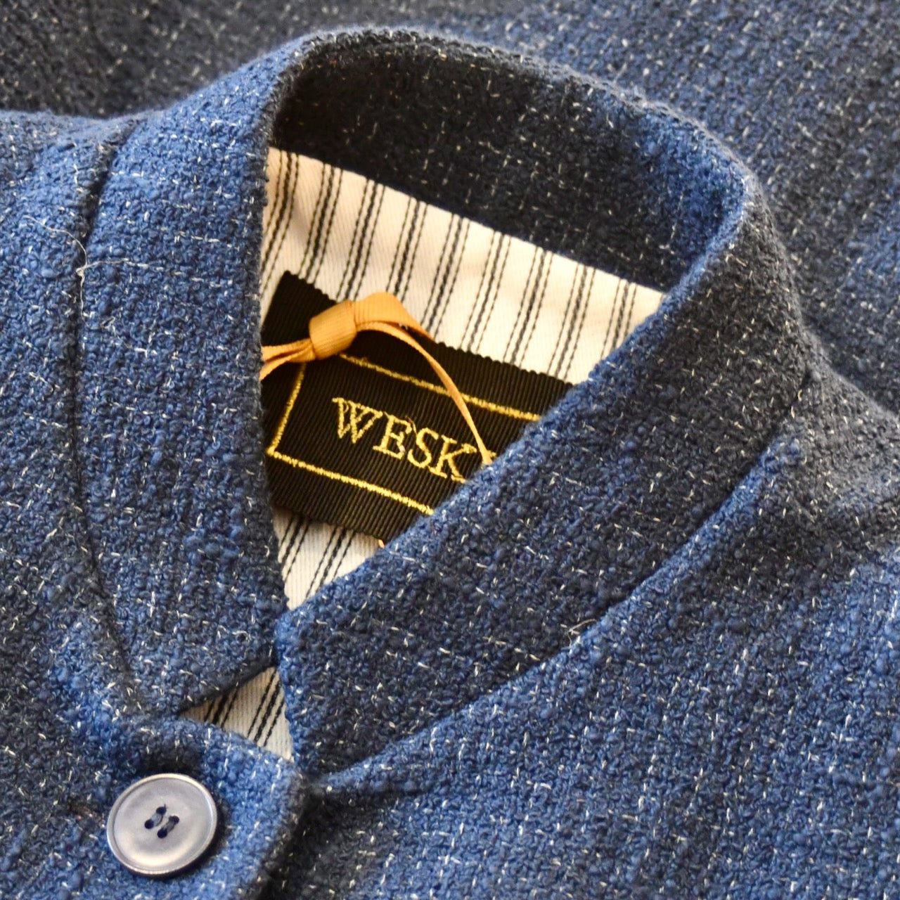 Collar detail on Ladies Waistcoat in Linton Tweeds Boucle. A pure cotton weave,  this is superbly trans-seasonal option. Handmade in London. 
