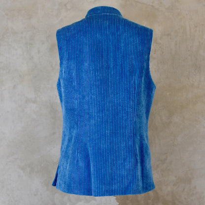 Rear View of Blue Cotton Corduroy Ladies Waistcoat. 
Handmade in London this longer length Gilet has a Nehru collar and bllue corozo buttons.