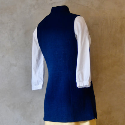 Rear side shot of Navy Ladies' Waistcoat in Linton Tweeds Boucle. This pure cotton boucle has a lightweight feel and a gentle handle. Perfect for spring, autumn and cooler summer days. Handmade in London.