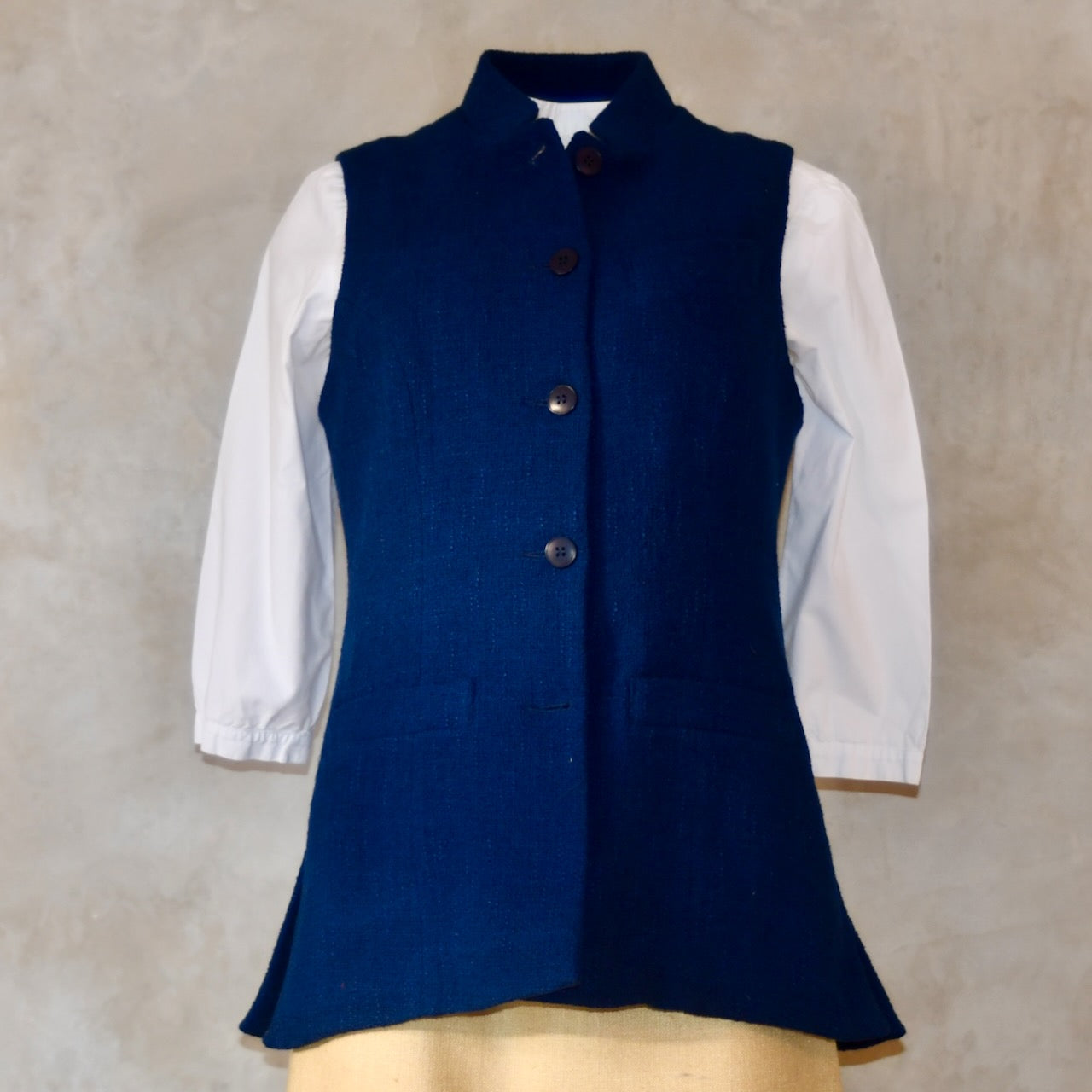 Navy Ladies' Waistcoat in Linton Tweeds Boucle. This pure cotton boucle has a lightweight feel and a gentle handle. Perfect for spring, autumn and cooler summer days. Handmade in London.