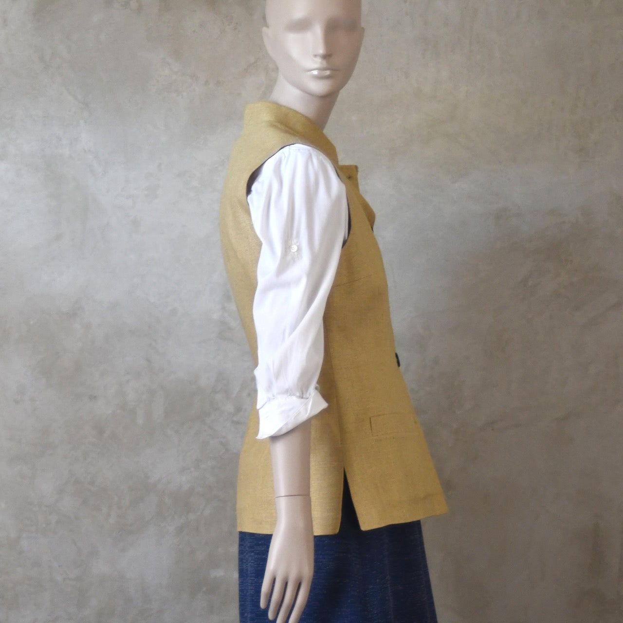 Buttoned side view of Ladies Silk Gilet in Sand coloured Silk Matka. Handmade in London with a Nehru Collar and Horn buttons.