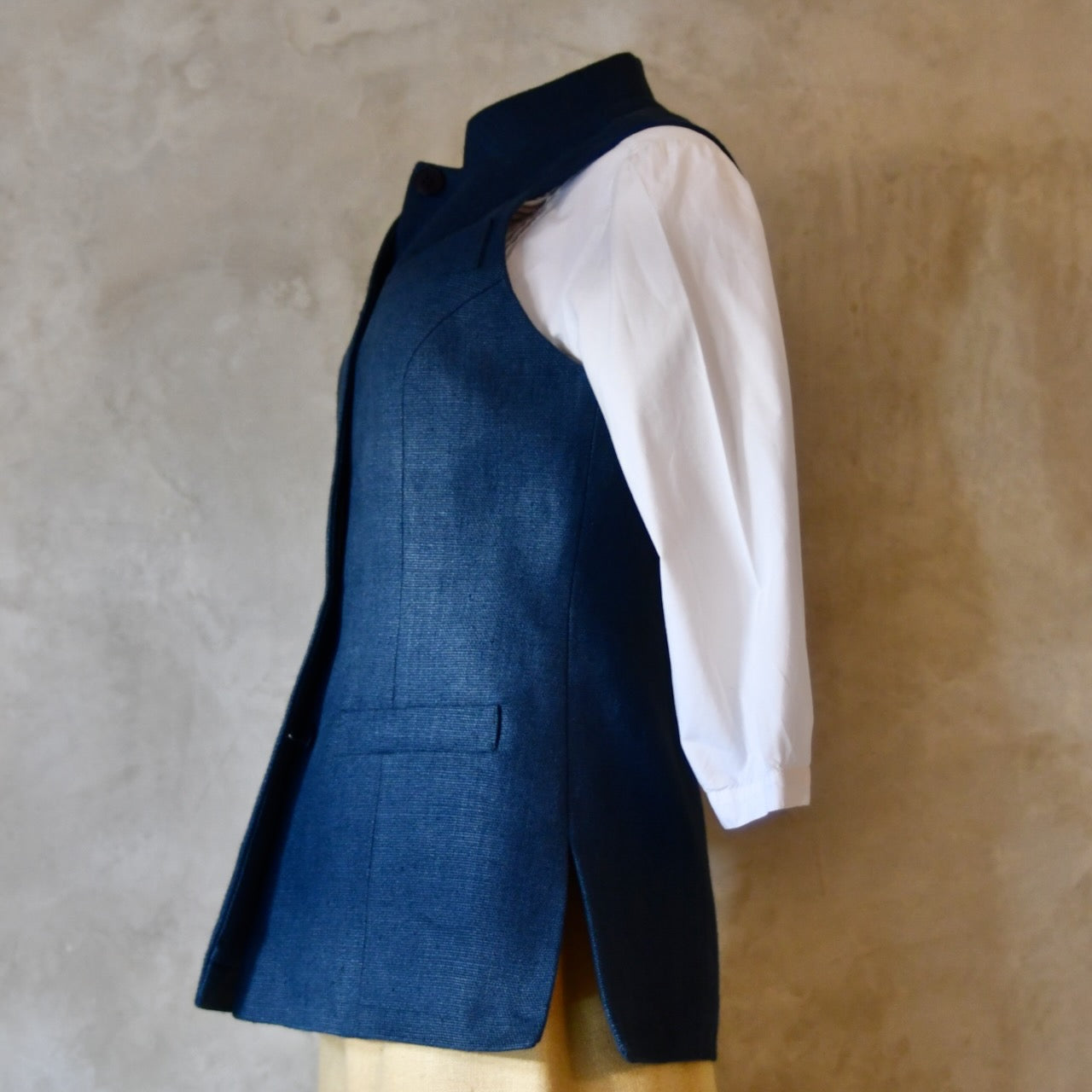 Full Side Shot of Ladies Gilet in Navy Linen. Made from a Heavy Weight Pure Irish Linen, this waistcoat is hand cut made and finished in London.
