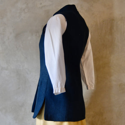 Rear Angled shot of Ladies Gilet in Navy Linen. Made from a Heavy Weight Pure Irish Linen, this waistcoat is hand cut made and finished in London.