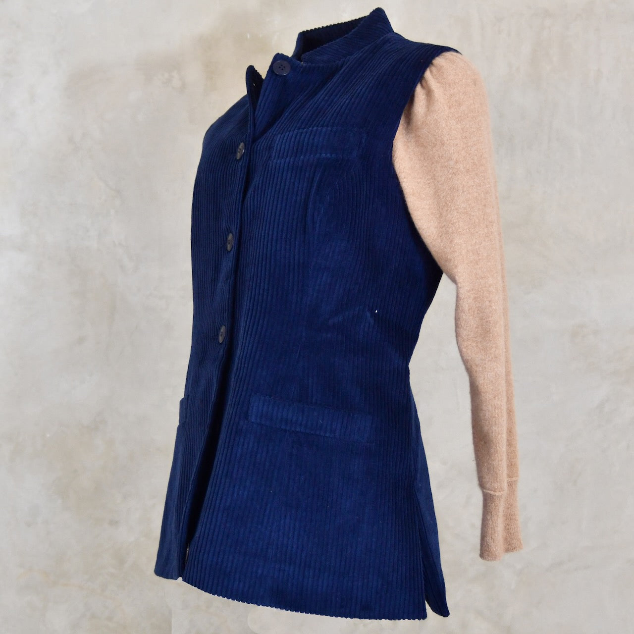 Ladies Dark Navy Cord Waistcoat. This pure cotton corduroy gilet is handmade in London. With a mandarin collar and smart cotton stripe ticking this gilet is made to last and last.