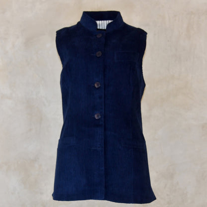 Full View of Ladies Dark Navy Cord Waistcoat. This pure cotton corduroy gilet is handmade in London. With a mandarin collar and smart cotton stripe ticking this gilet is made to last and last.