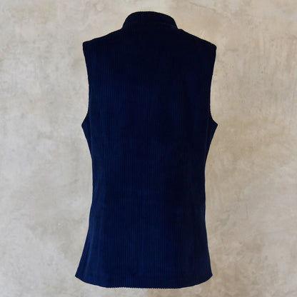 Rear View of Ladies Dark Navy Cord Waistcoat. This pure cotton corduroy gilet is handmade in London. With a mandarin collar and smart cotton stripe ticking this gilet is made to last and last.