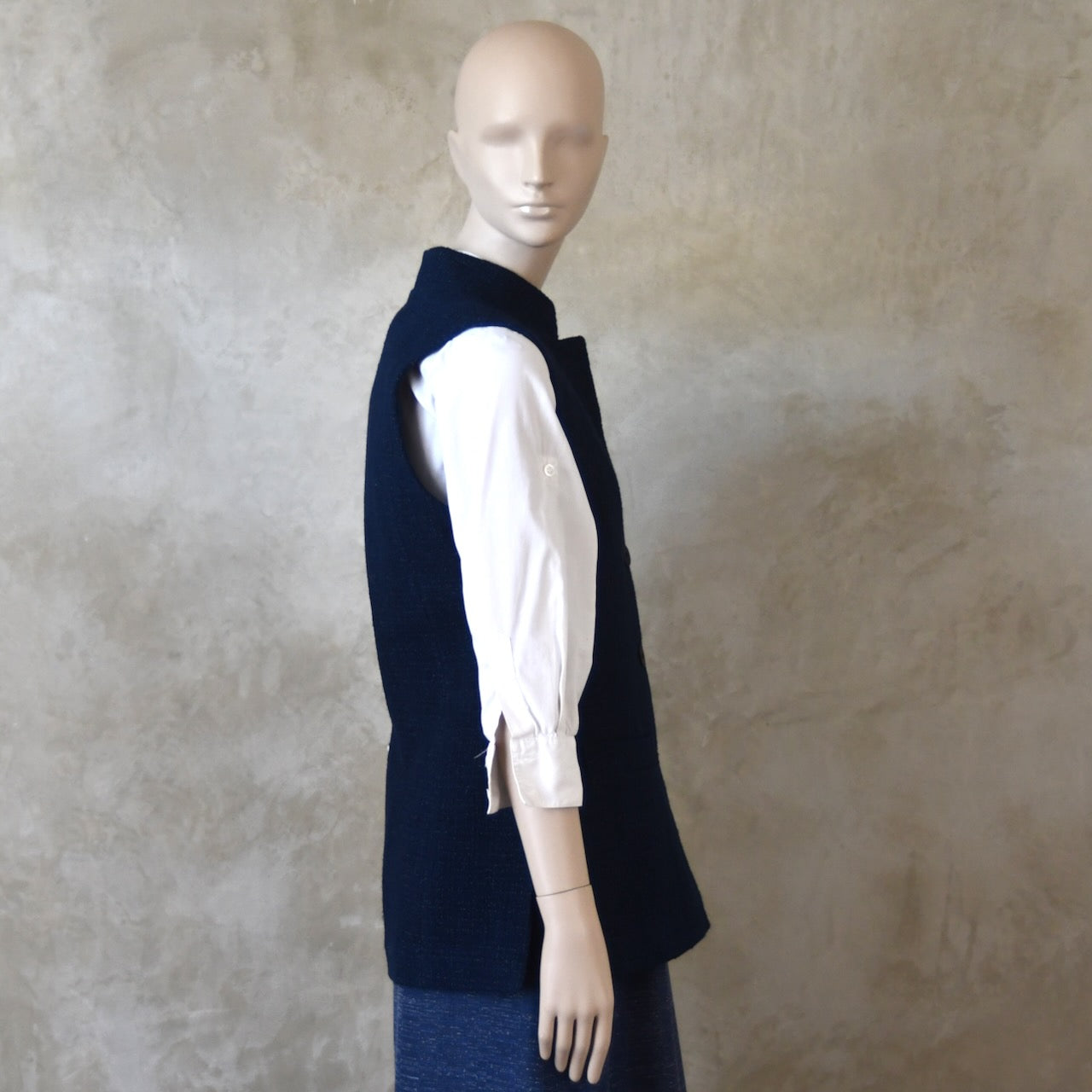 Side shot of Longer Length Ladies Waistcoat in Linton Tweeds Boucle. A pure cotton weave,  this is superbly trans-seasonal option. Handmade in London. 